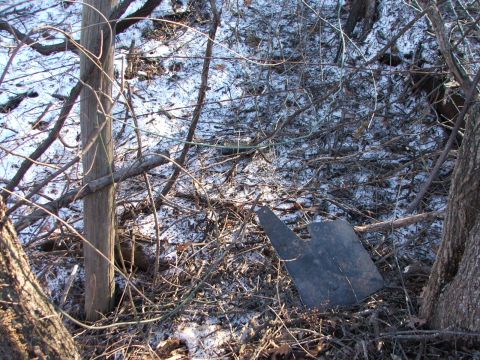 1990 Dodge Shadow - A single mud flap is visible in a snowy, wooded area.