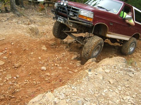1993 Ford Bronco - This 1993 Ford Bronco is tackling a challenging off-road course with significant articulation.