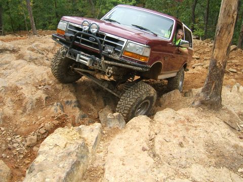 1993 Ford Bronco - This 1993 Ford Bronco tackles a challenging off-road course with steep inclines and large rocks.
