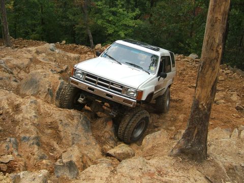 1993 Ford Bronco - This modified Toyota 4Runner tackles a challenging rocky terrain, its off-road capabilities.