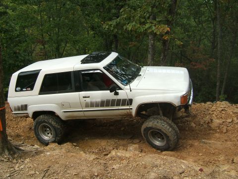 1993 Ford Bronco - This lifted 1993 Toyota 4Runner navigates a rocky, wooded trail.