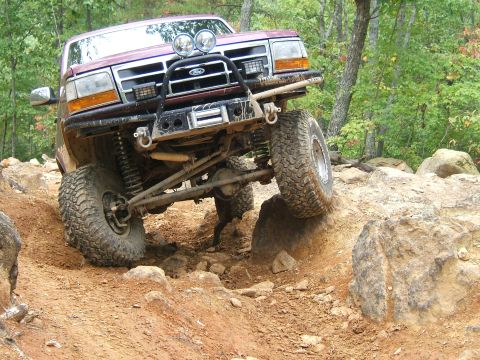 1993 Ford Bronco - This 1993 Ford Bronco navigates a challenging rocky terrain during an off-road excursion.