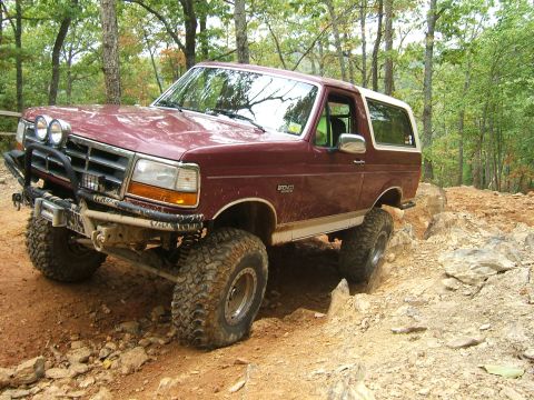 1993 Ford Bronco - This 1993 Ford Bronco is shown tackling a challenging rocky terrain during an off-road excursion.