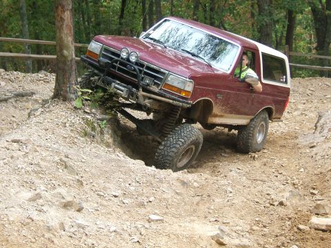 1993 Ford Bronco - This 1993 Ford Bronco navigates a challenging off-road course, demonstrating its capabilities.