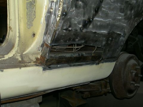 1967 Ford Ranchero - This image shows a vehicle's side panel undergoing bodywork, with evidence of rust repair and welding.