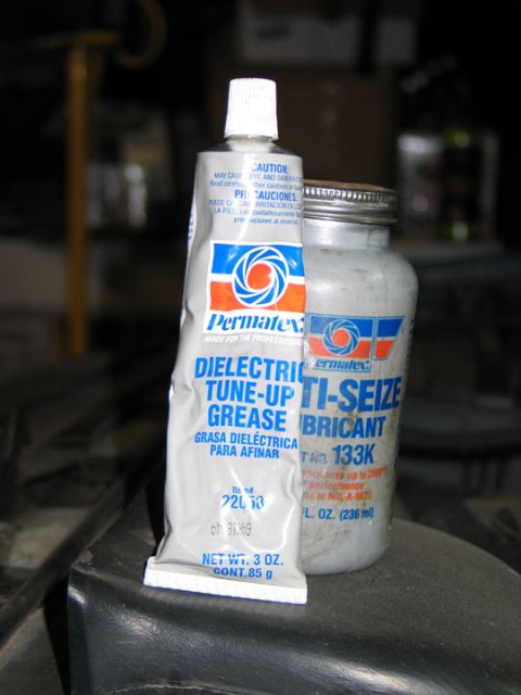 1994 Ford Bronco - Permatex dielectric tune-up grease and anti-seize lubricant bottles are shown close up.
