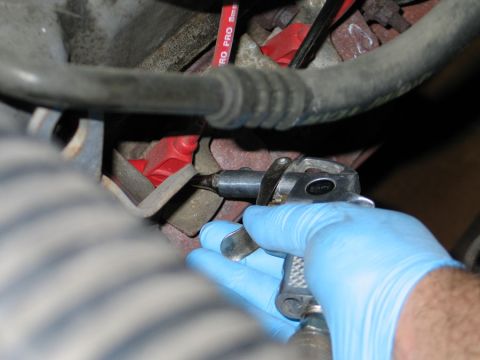 1994 Ford Bronco - Cleaning engine components with an air duster.