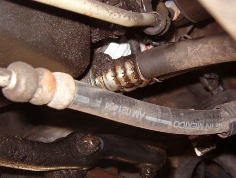 1999 Ford Crown Victoria - The bolt head is hidden under the pile of grime.