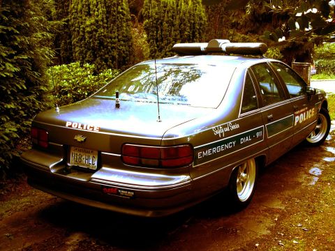 1991 Ford Crown Victoria - This 1991 Ford Crown Victoria police car is seen from the rear quarter angle, parked outdoors.