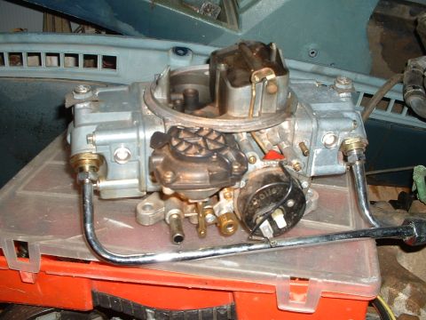 1985 Ford Bronco - Close-up of a Holley carburetor, a key engine component for fuel delivery.
