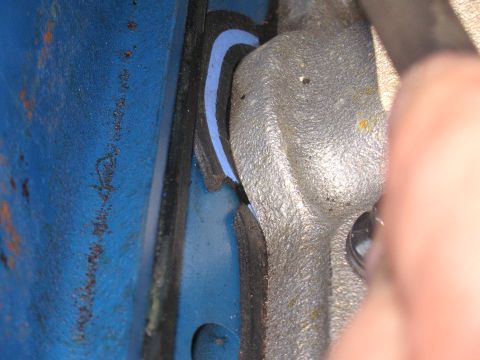 1979 Ford F-250 - Engine part installation showing gasket material.