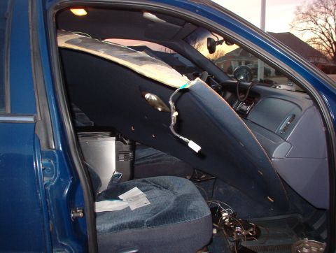 1999 Ford Crown Victoria - Next, rotate the headliner's LHR corner (at the bottom near the driver's door) up along the L side of the car & work the LHF corner through…