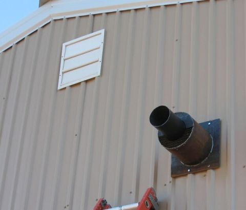1986 Ford Ranger - Exterior of a building showing a vent and an exhaust pipe, with a ladder in view.