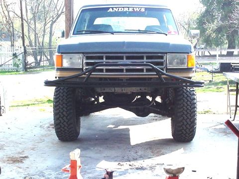 1988 Ford Bronco - This Ford F-Series truck features a custom front bumper and off-road tires, with 'ANDREWS' visible on the windshield.
