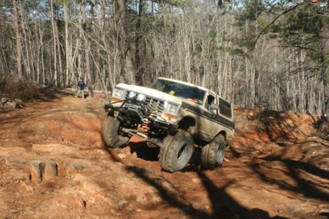 1992 Ford Mustang - This modified Ford Bronco navigates a challenging off-road trail.