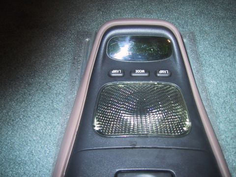 1994 Ford Bronco - Interior overhead console with controls for lights and mode selection.
