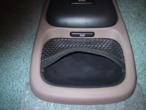 1994 Ford Bronco - Interior overhead console part a storage bin and an 'open' button.