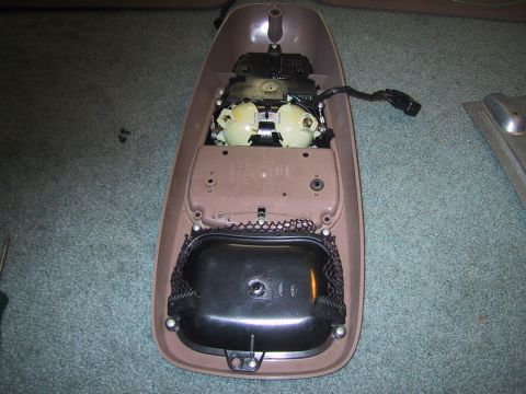 1994 Ford Bronco - Interior overhead console part removed from a vehicle, showing internal components and wiring.
