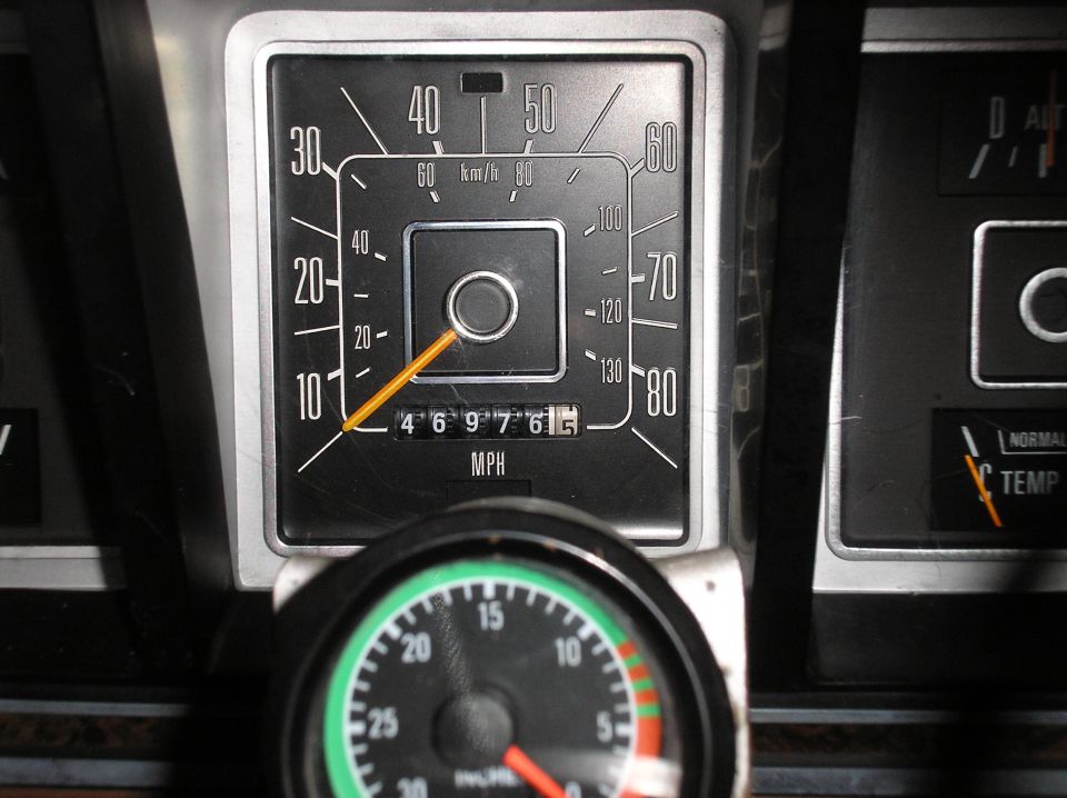 1978 Ford Bronco dashboard with speedometer and temperature gauge visible