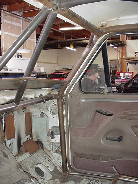 1988 Ford Bronco - Interior view of a 1988 Ford Bronco showing custom roll cage installation.