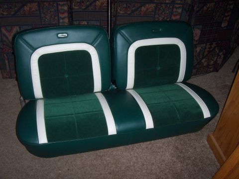 1994 Ford F-150 - Bench seat with green velour inserts and white trim, likely from an older vehicle.
