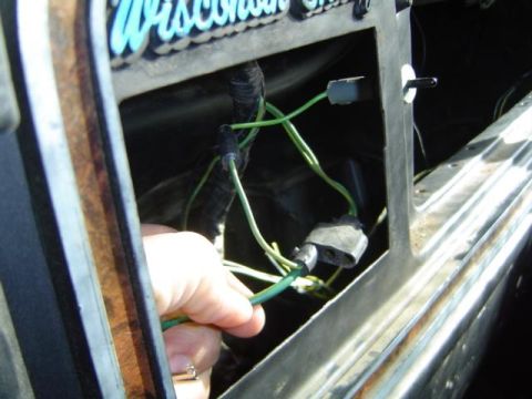 1979 Ford Bronco - Repairing a vehicle's wiring harness with green wires and connectors.