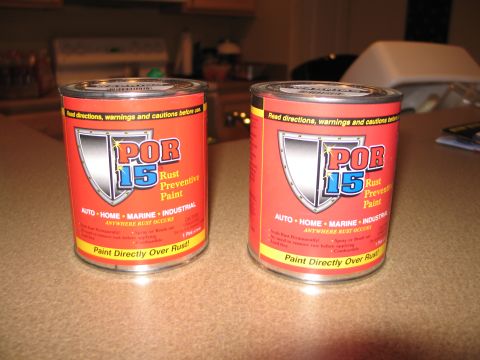 1995 Ford Bronco - Two cans of POR-15 Rust Preventive Paint are shown on a countertop, ready for use.