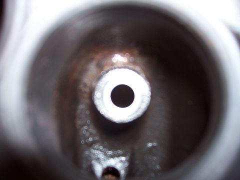 1979 Ford Bronco - This image shows a close-up view of a valve stem seal, a critical engine component.