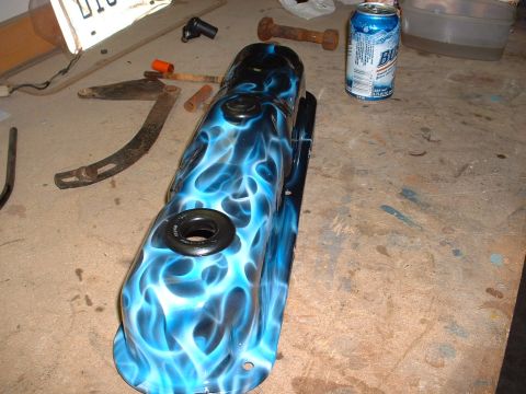 1978 Ford Mustang II - A custom-painted valve cover with a blue flame design sits on a surface with various tools and a can of beer.