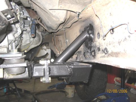 1994 Ford Bronco - Close-up of a custom crossmember modification, likely for a vehicle drivetrain swap.