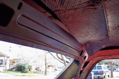 1972 Ford Ranchero - Interior view of a vehicle's roof structure, showing exposed metal and sound deadening.