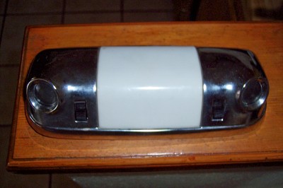 1972 Ford Ranchero - This is a vehicle interior dome light with a chrome housing and a white diffuser.