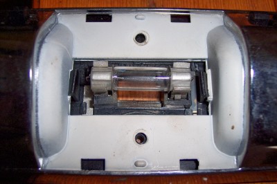 1972 Ford Ranchero - Close-up of a fuse holder assembly, showing a glass fuse with copper elements.