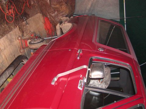 1991 Ford Bronco - This 1991 Ford Bronco is shown from the front 3/4 angle, with its red paint gleaming.