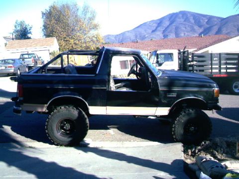1989 Ford Bronco - 1989 Ford Bronco shown from the side with its top removed.