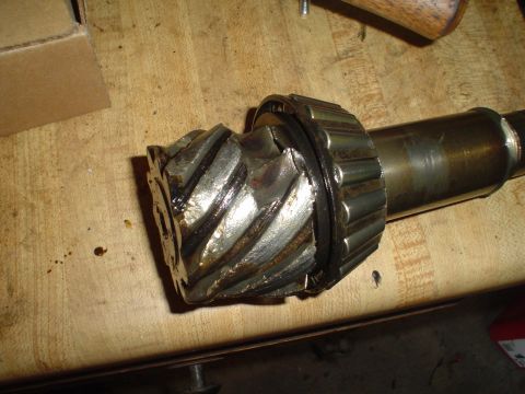 1967 Ford F-250 - Close-up of a broken differential ring gear and bearing, likely from a vehicle's rear axle.