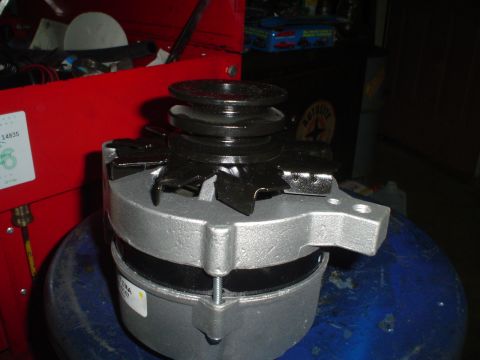 1967 Ford F-250 - A close-up view of a vehicle alternator, a crucial component for electrical systems.