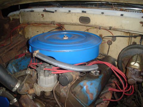 1967 Ford F-250 - The engine bay shows a V8 engine with a blue air cleaner and red spark plug wires.