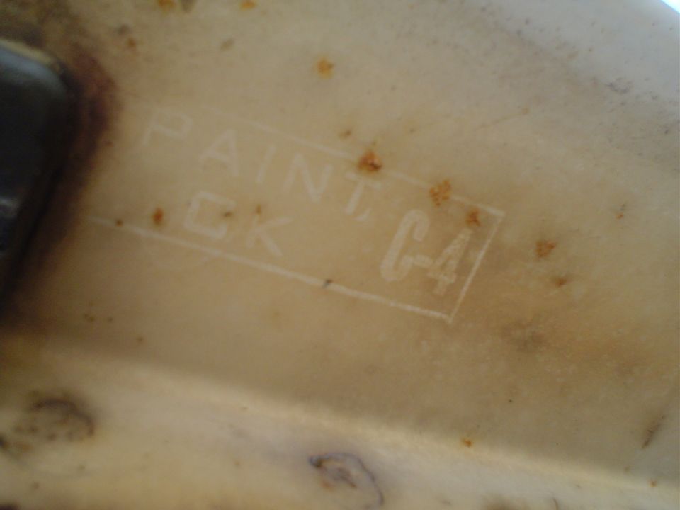 Stamped text on a cream-colored part: PAINT CK C-4
