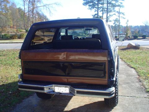 1984 Ford Bronco - Rear view of a Ford Bronco, likely early 1980s model, showing tailgate and bumper details.