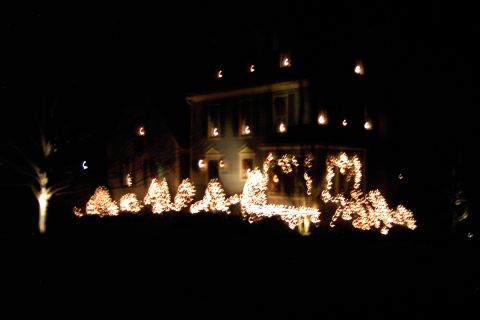 1996 Mercury Grand Marquis - A house is covered in Christmas lights for the holiday season.