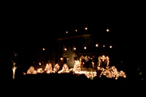 1996 Mercury Grand Marquis - A house is adorned with many lights, creating a festive scene at night.