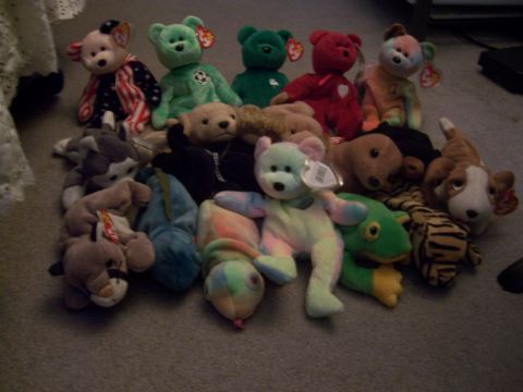 1987 Volkswagen Golf - A variety of plush toys are arranged on a carpeted floor.