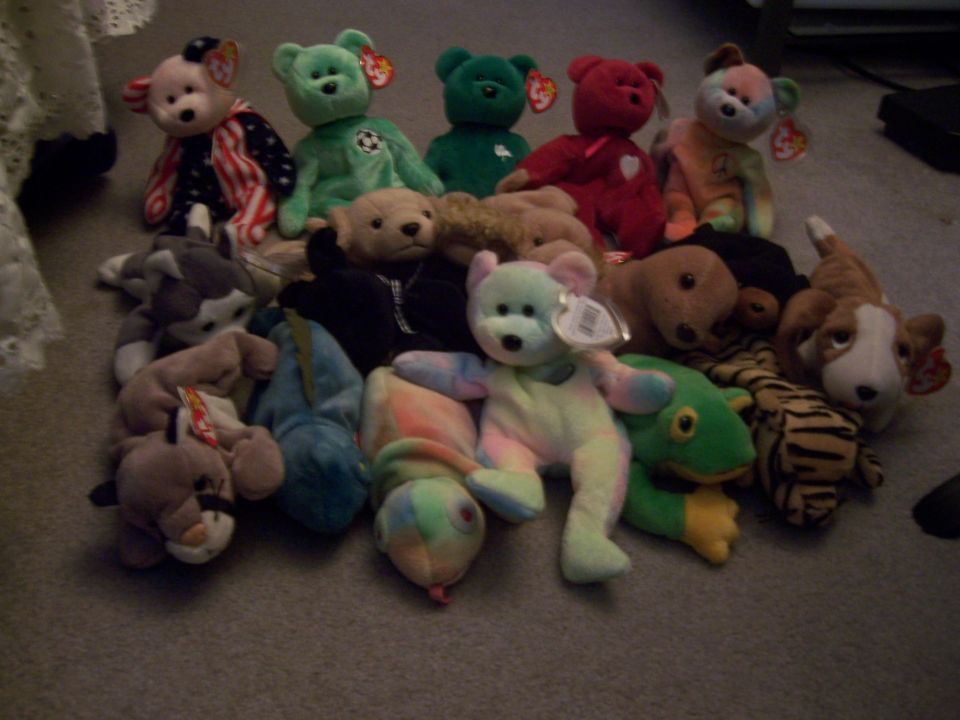 Collection of stuffed animals including bears, a dog, and a tiger