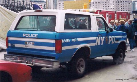 1986 Ford Bronco - A Ford Bronco marked as NYPD patrol vehicle with "POLICE" on the tailgate and "NY PD" on the side.