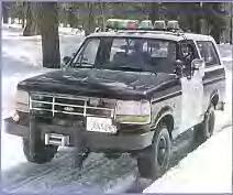 1986 Ford Bronco - This Ford Bronco SUV, likely from the early 1990s, is parked in a snowy outdoor setting.