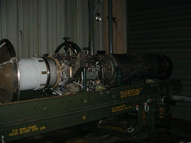 Jet engine on a green stand with readable text labels