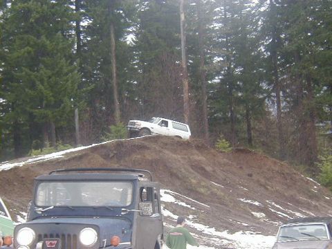 1994 Ford Explorer - A white 1994 Ford Explorer navigates an off-road incline during a winter event.