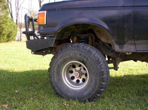 1991 Ford Bronco - Front view of a black Ford Bronco with an aftermarket bumper and bull bar.