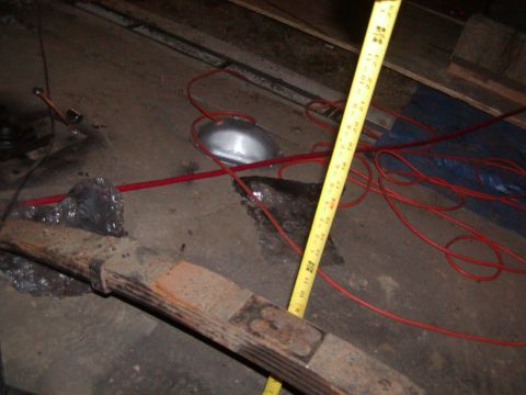 1991 Ford Bronco - A leaf spring is measured with a yellow tape measure. The registry claims it is from a 1991 Ford Bronco, but this cannot be confirmed from…